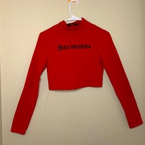 Red cropped graphic tee. “Still Dreaming “